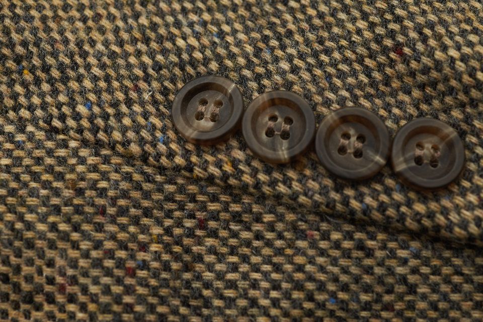 Buttons on a tweed jacket sleeve